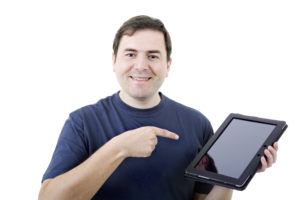 Guy holding tablet to illustrate electronic documents